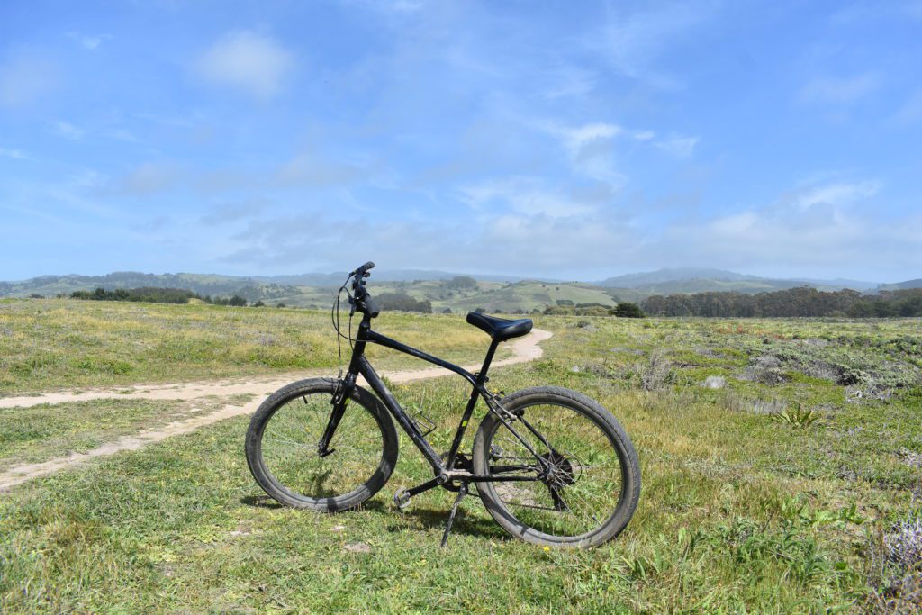 Bike with beautiful view of Santa Cruz Mountains and dream biking and hiking trails in the background of Half Moon Bay