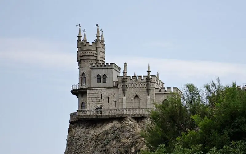 Swallow's Nest in Crimea perched dramatically on a cliff overlooking the sea.