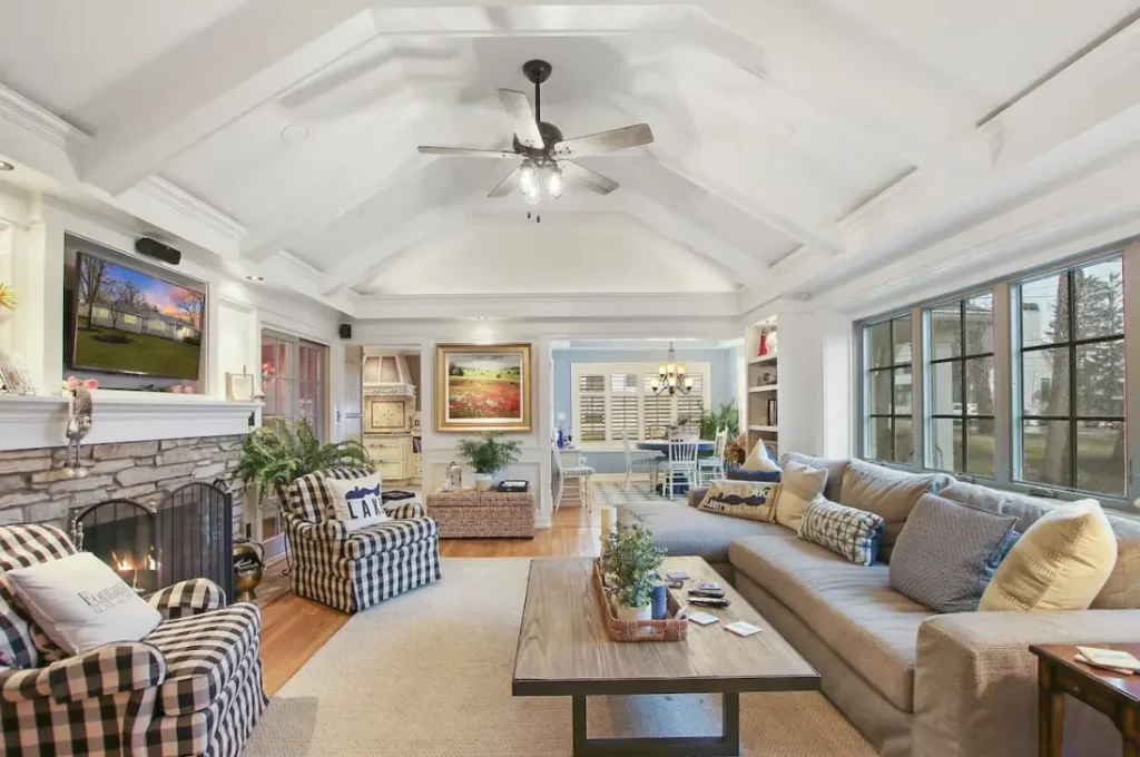 Living room with TV and fireplace