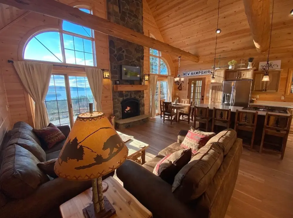 The living room and kitchen area with the gorgeous view out the giant windows