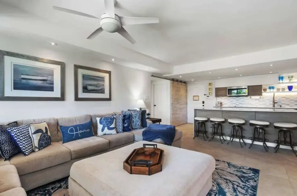 Spacious kitchen with barstool seating and living room area