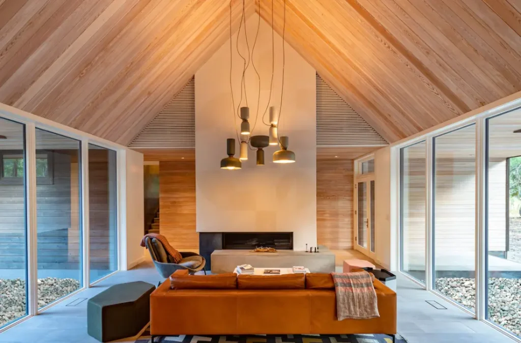 Great room gas fireplace opens up to floor-to-ceiling windows