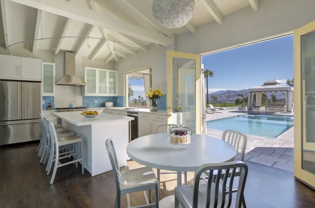Kitchen features Viking appliances and direct pool access with incredible views.