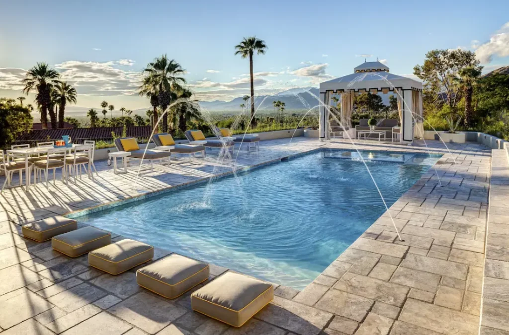 Dramatic water feature, water shelves accent the area by the spa and cabana.