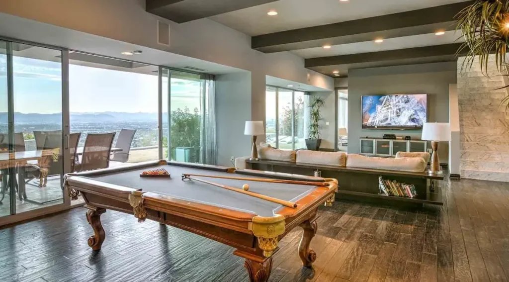 Pool Table and TV room next to theater and bedroom 5