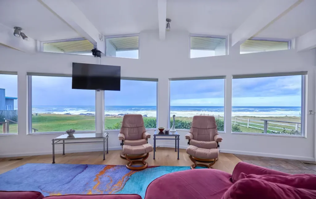 Living room with large windows facing the ocean