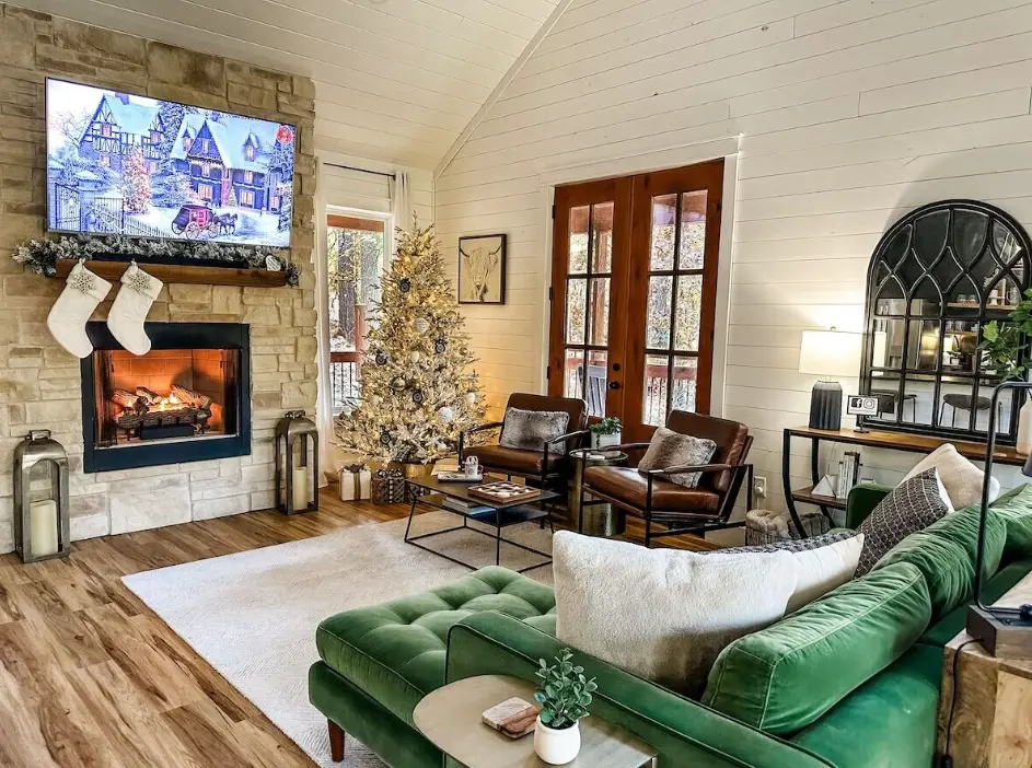 The green velvet couch is the perfect place to cozy up for some Christmas movies