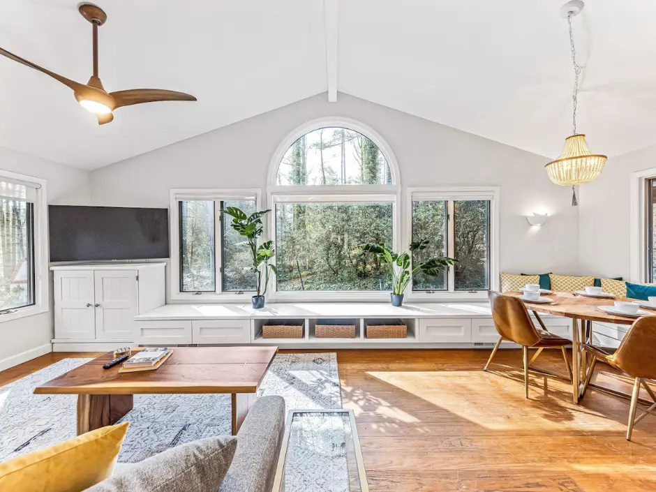 Gorgeous sunroom with huge window to enjoy nature while sipping your coffee or wine