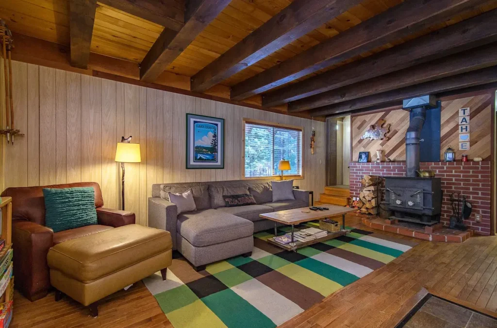 Cozy living room with comfortable seating and real wood-burning stove