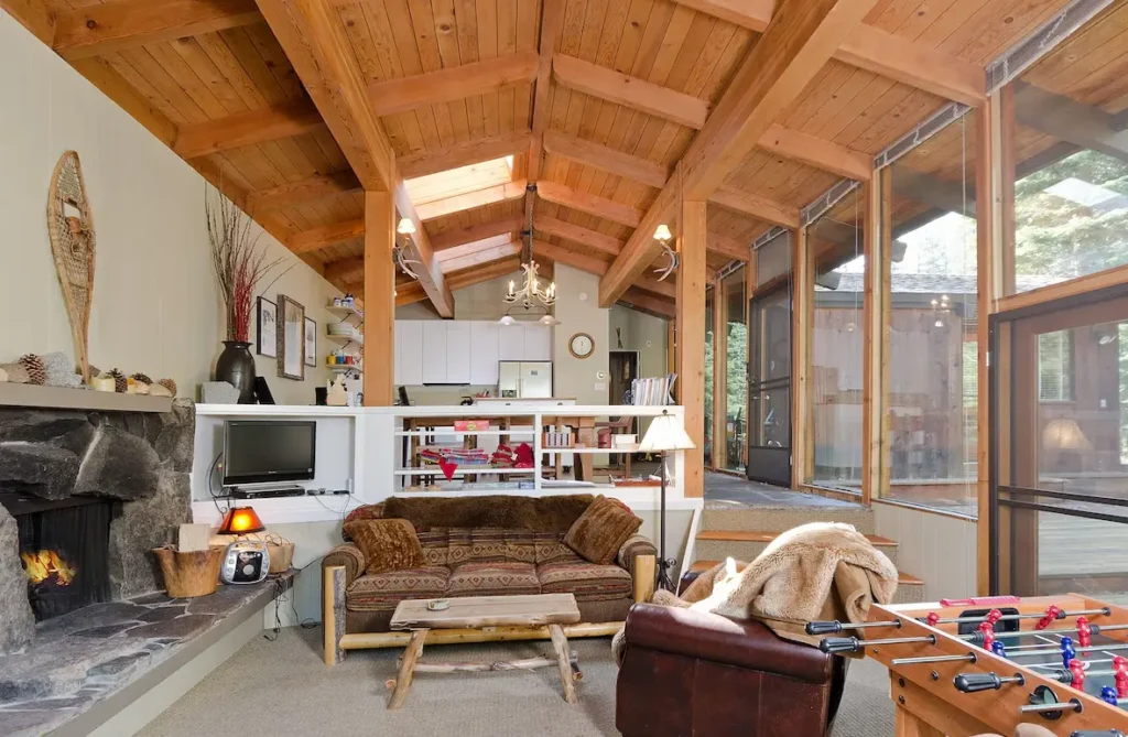 Cozy Great Room with local Mount Pluto volcanic stone fireplace. 3 doors to deck