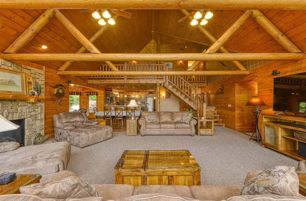 Full view across great room from lakefront windows back towards the kitchen