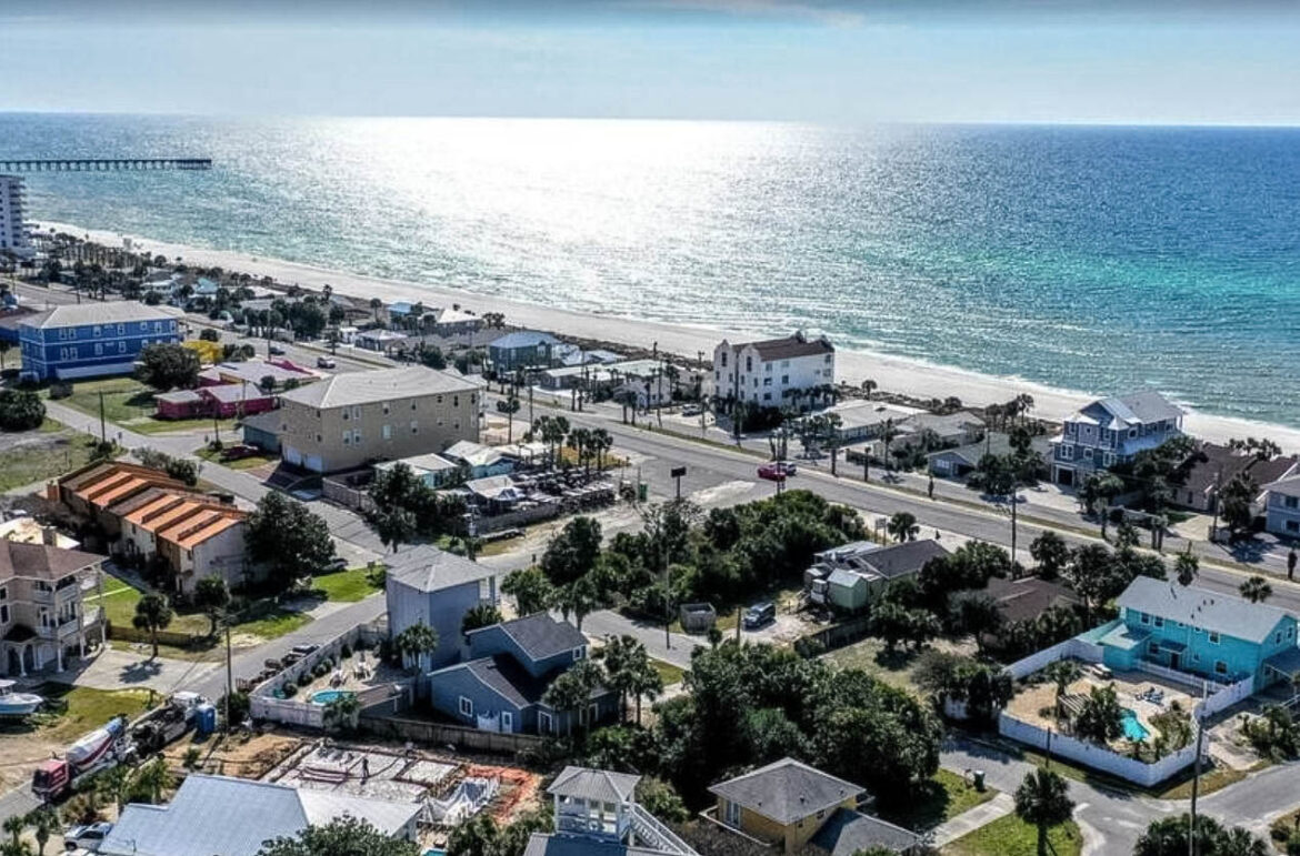 aerial shot looking over Panama City Beach with the Gulf of Mexico in the distance