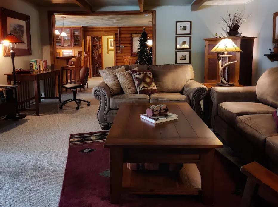 Living room looking into writing desk area and dining beyond
