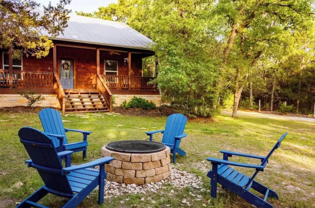 Front yard with firepit and supplied firewood and starters