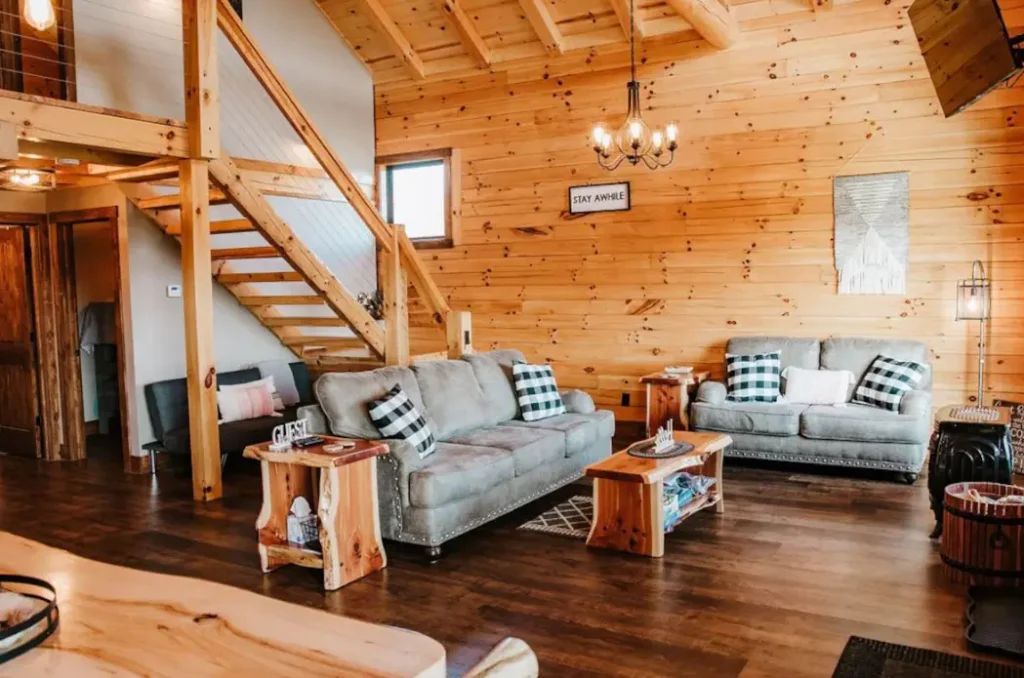 Lofted ceilings and relaxed furniture welcome guests to the cabin