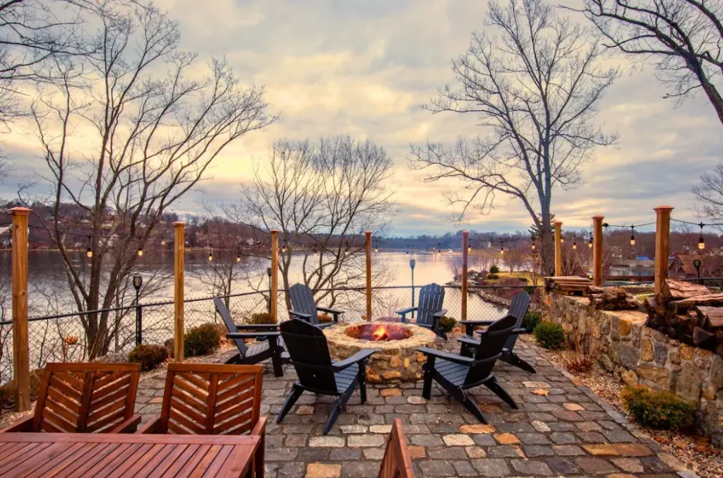 Relax by the firepit and enjoy the stunning lake views