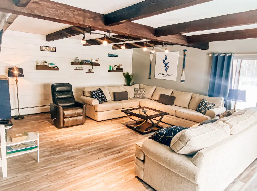 Large living room with ample seating and lake views