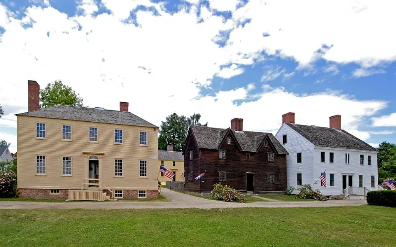 Historic colonial-style homes stand in a row at the Strawbery Banke Museum.
