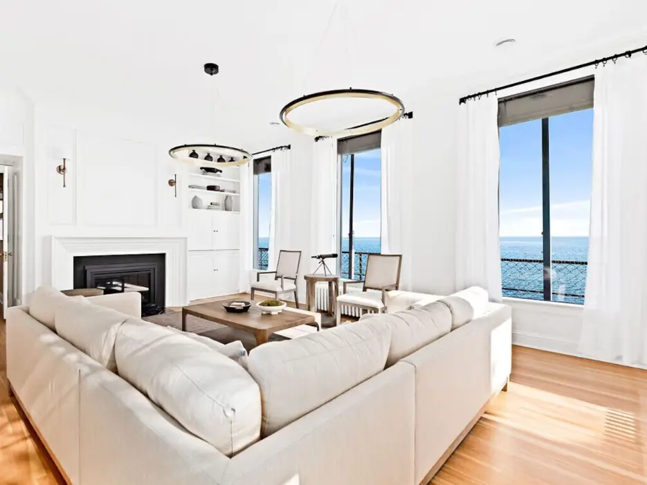 Cozy driftwood fireplace in Grand living room at Pumphouse on Lake Superior
