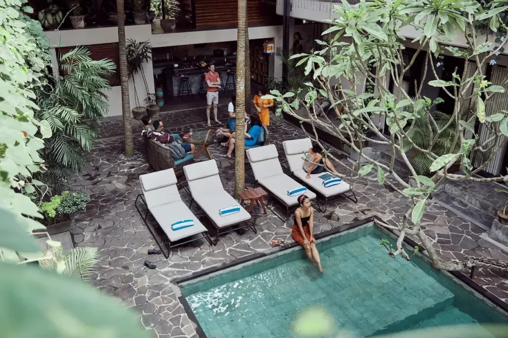 Overhead view of an Outsite tropical courtyard in Ubud with lounge chairs and a plunge pool in 2026