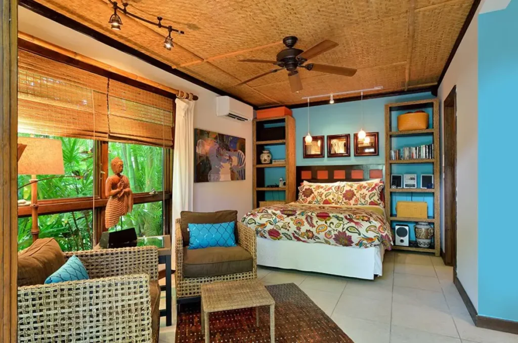 The combination sitting and sleeping area with a queen size bed