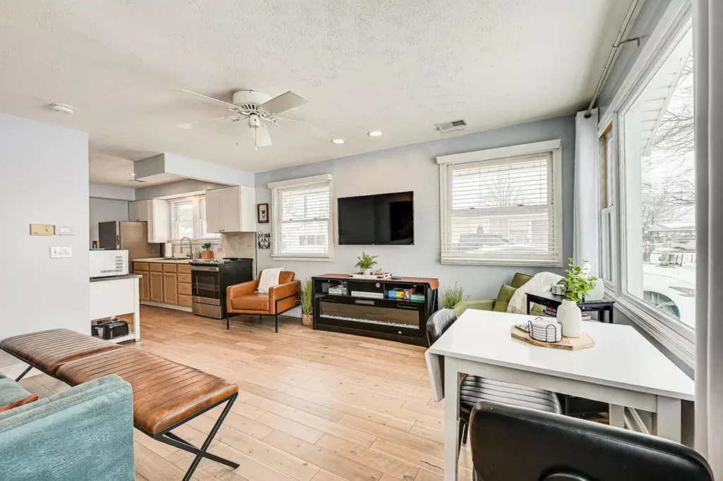 Bright open concept living room and dining space with light wood flooring