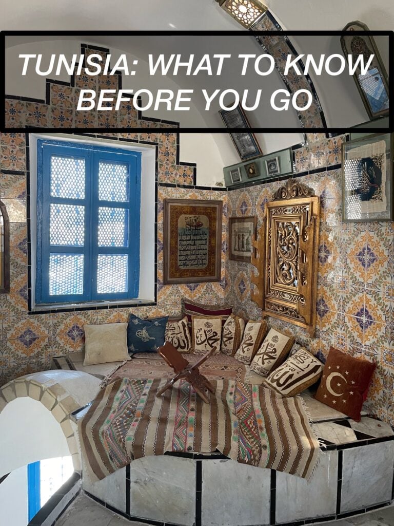 tunisia travel guide pinterest graphic over image of inside a tunisian house