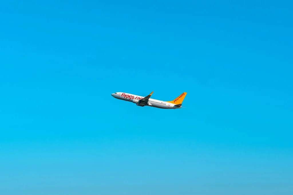 Pegasus Airlines plane in flight, one of the cheapest airlines in Europe.
