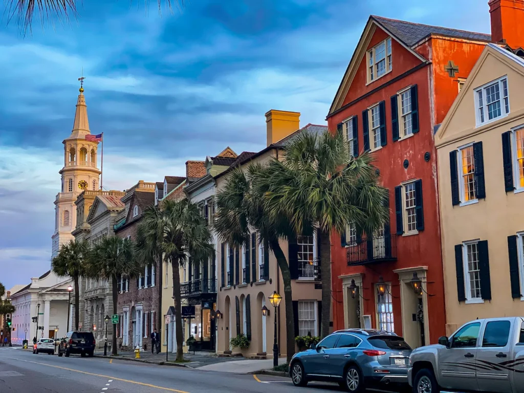 Colorful historic buildings and a church steeple along Broad Street in Charleston, South Carolina