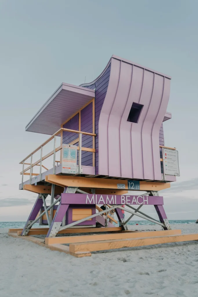 Vibrantly painted 12th Street lifeguard tower sitting on the sand at Miami Beach
