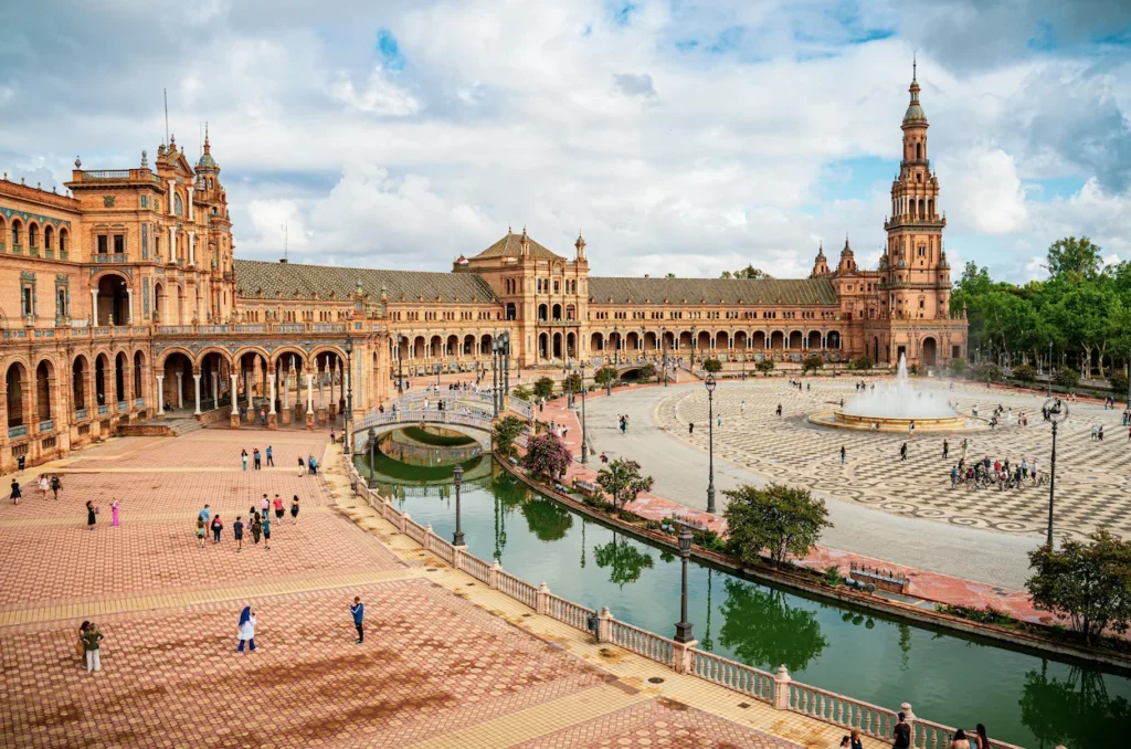 Renaissance Revival building of Plaza de España with its canal and central fountain in Seville