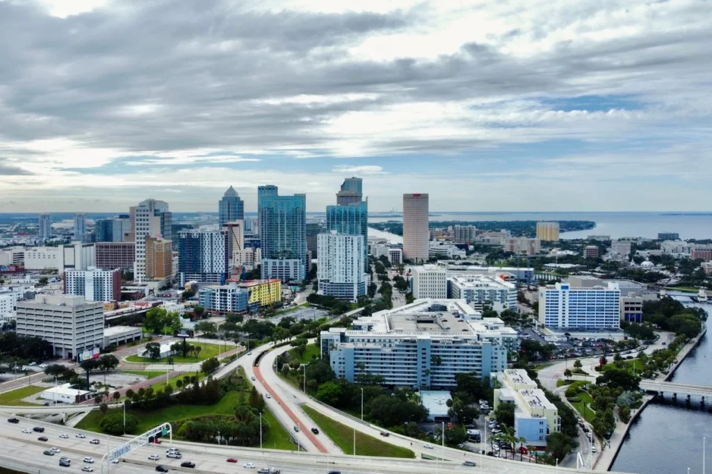 An aerial view of the downtown Tampa skyline under a cloudy sky
