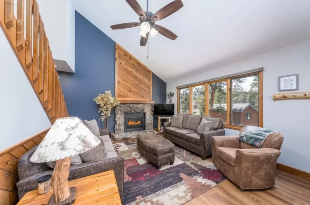Warm & welcoming living room with gas fireplace and great views