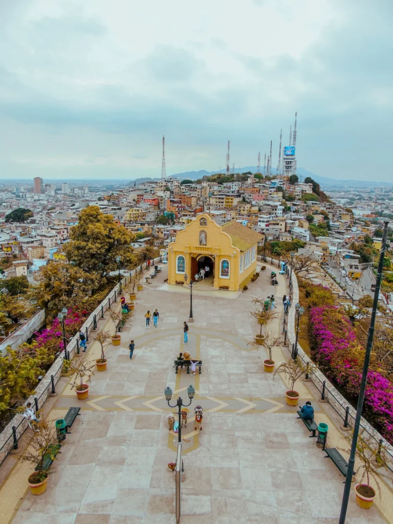 Yellow chapel on a stone plaza at the top of Cerro Santa Ana overlooking the city of Guayaquil