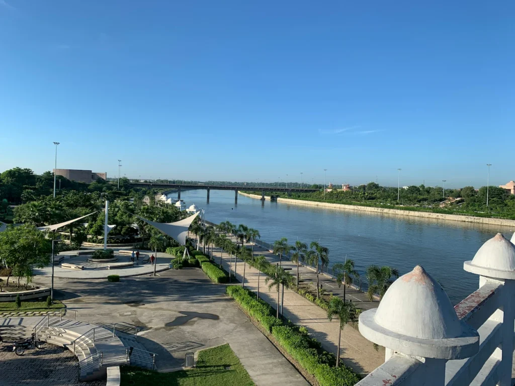 Elevated view of a riverside promenade and walking paths at Gomti Riverfront Park