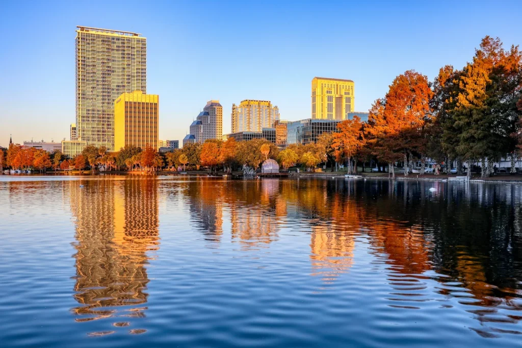The downtown Orlando skyline rising behind Lake Eola Park and its famous water fountain