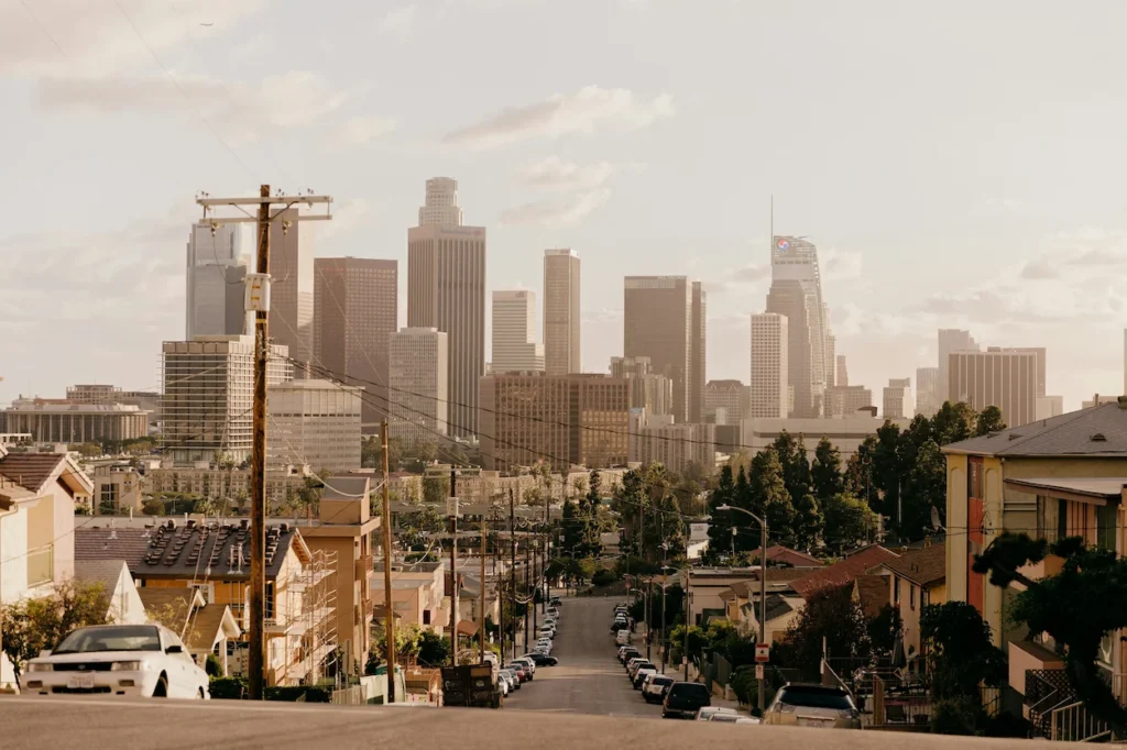 Downtown Los Angeles skyline viewed from a steep neighborhood street