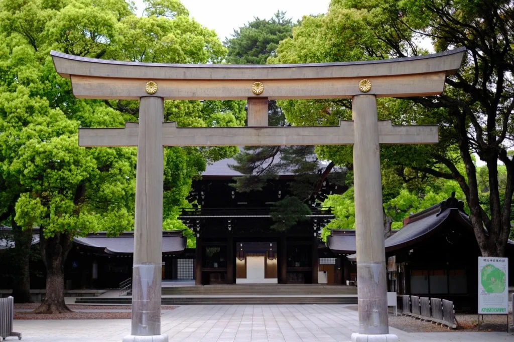 Large wooden torii gate leading to the Meiji Shrine entrance in Tokyo