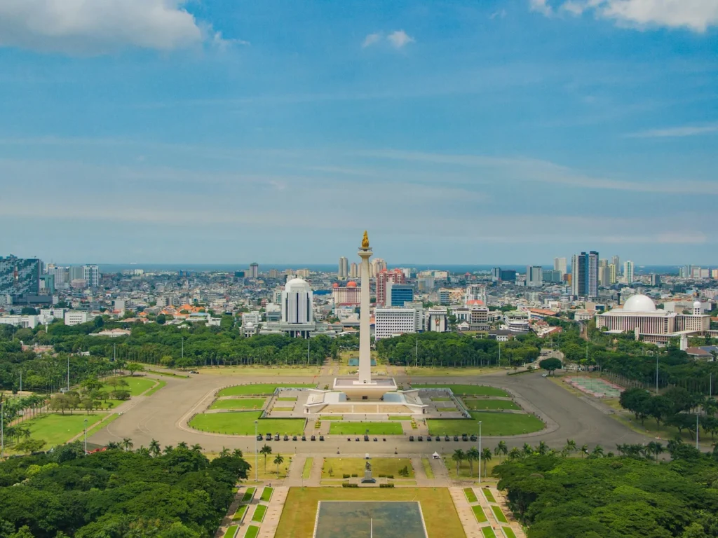 Aerial view of Monas tower and Merdeka Square with Jakarta city skyline