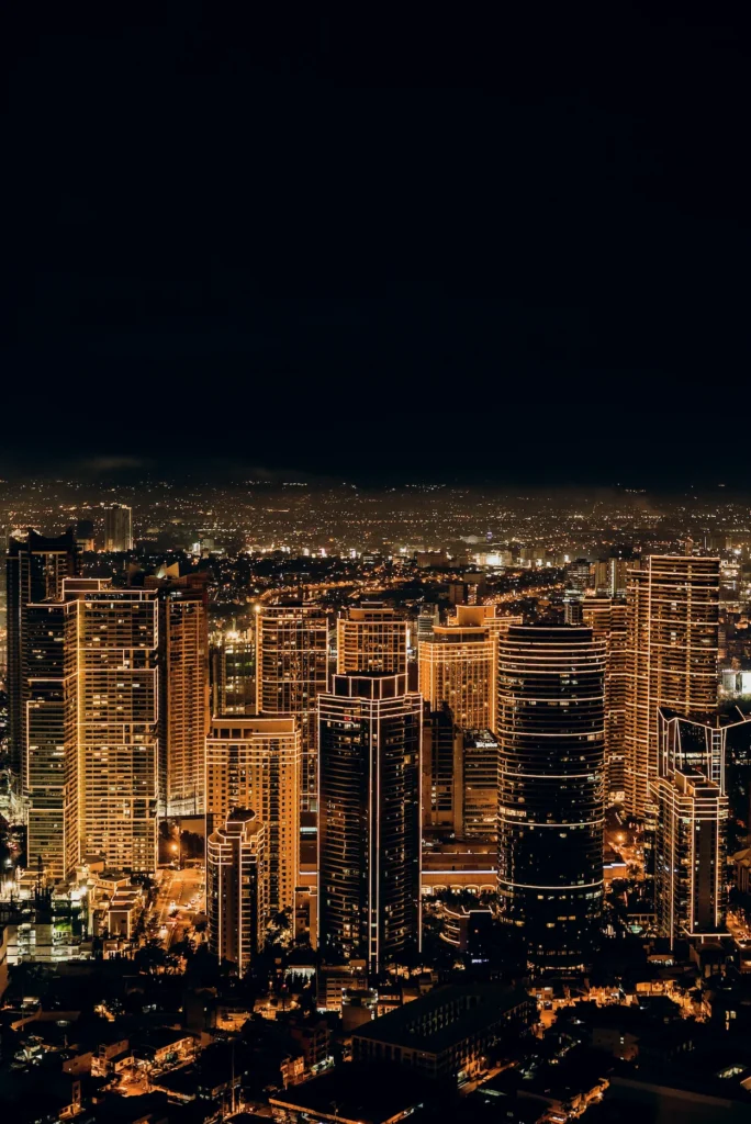 Illuminated skyscrapers of Rockwell Center in Makati, Metro Manila, Philippines at night