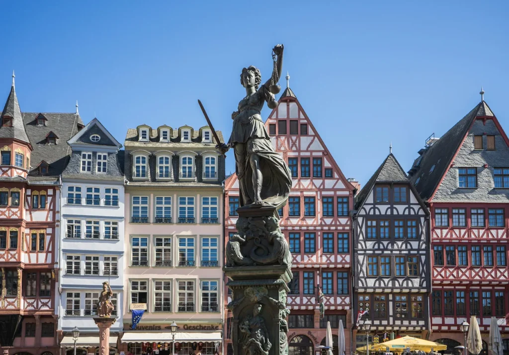 The Fountain of Justice statue in front of half-timbered houses at Römerberg square in Frankfurt