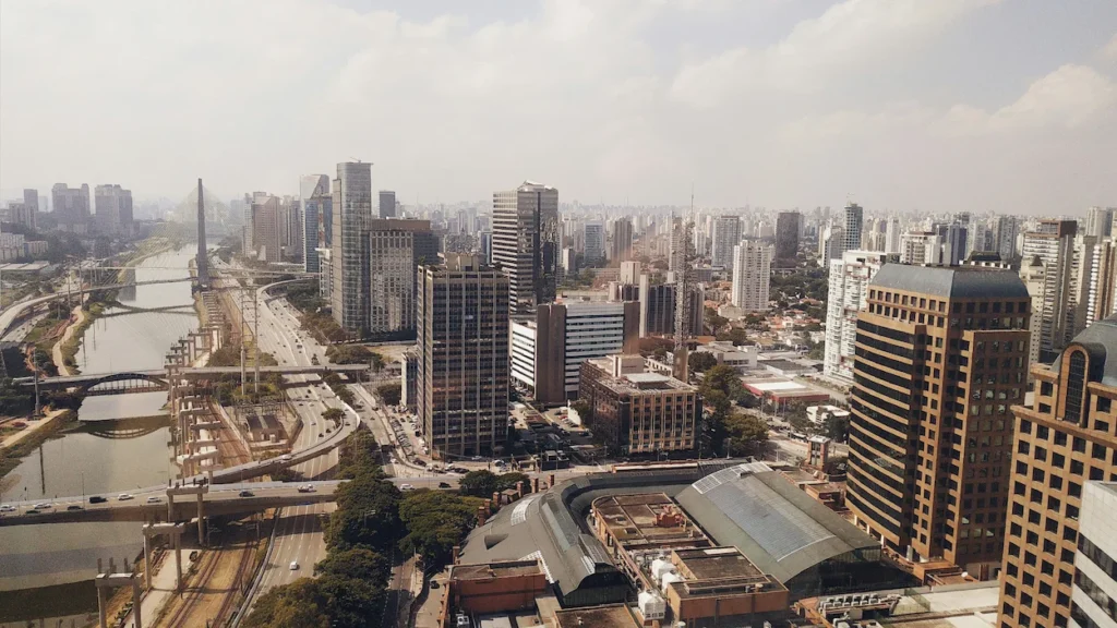 Aerial view of high-rise skyscrapers along the Pinheiros River and highways in São Paulo
