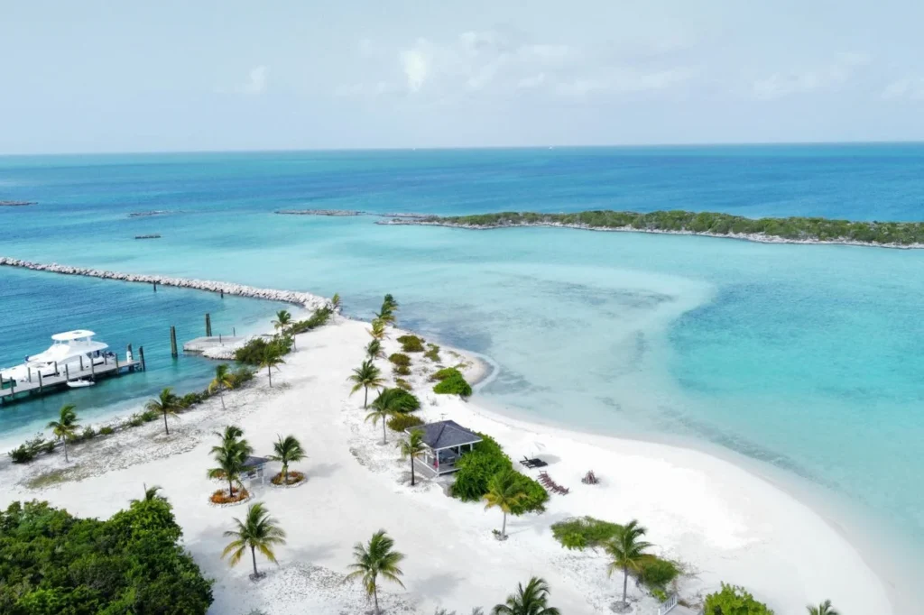Aerial view of a white sand beach and tropical lagoon in the Bahamas
