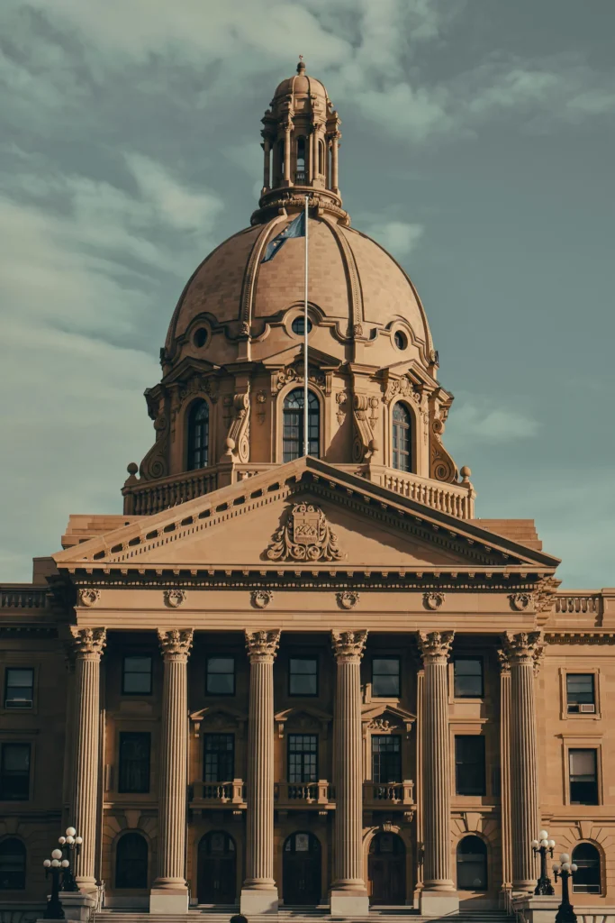 Close-up of the historic dome and columned entrance of the Alberta Legislature Building