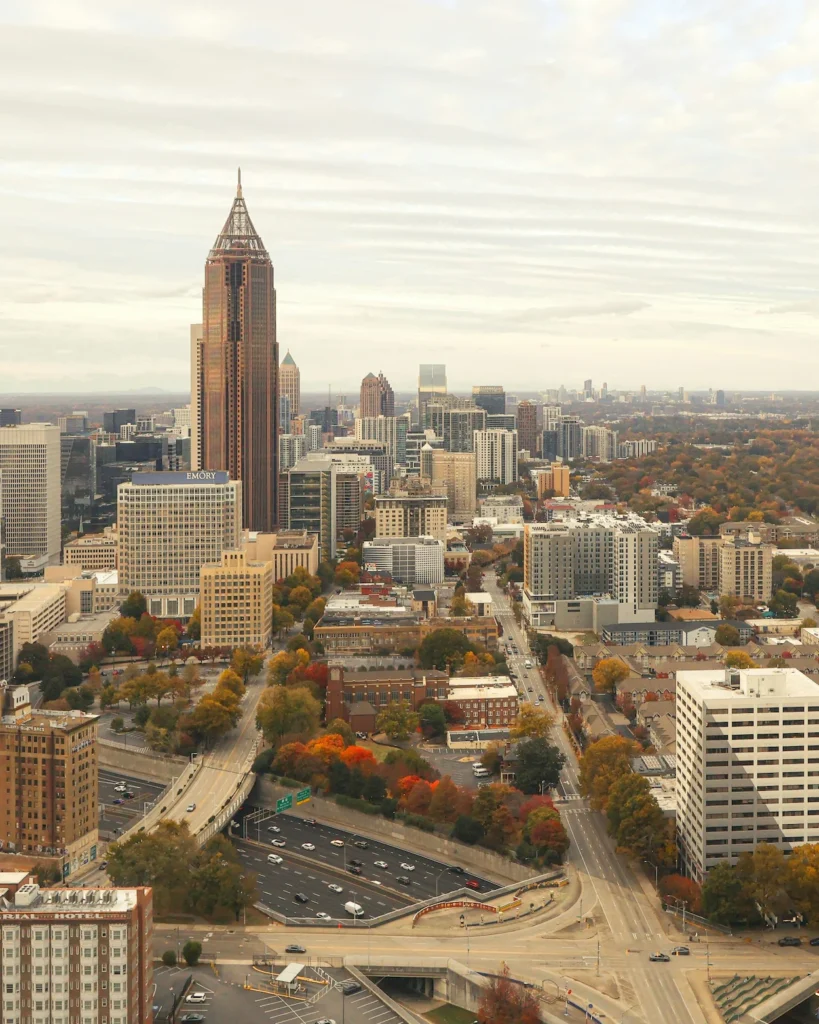 Bank of America Plaza skyscraper towering over Midtown buildings and a highway in Atlanta, Georgia
