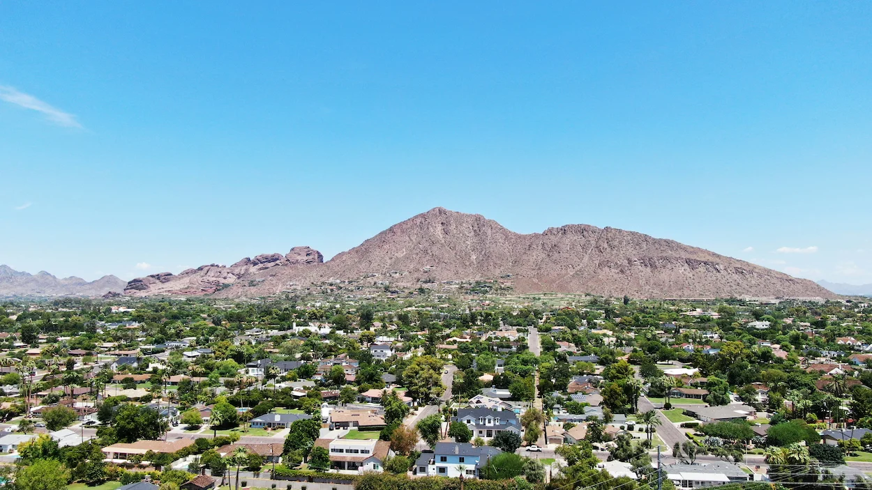 An aerial view of Camelback Mountain rising above a residential neighborhood in Phoenix