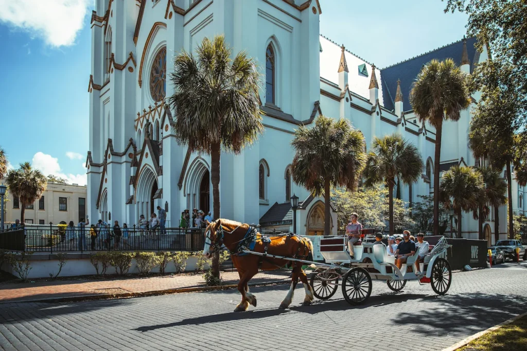 Horse-drawn carriage passing the Cathedral Basilica of St. John the Baptist in Savannah