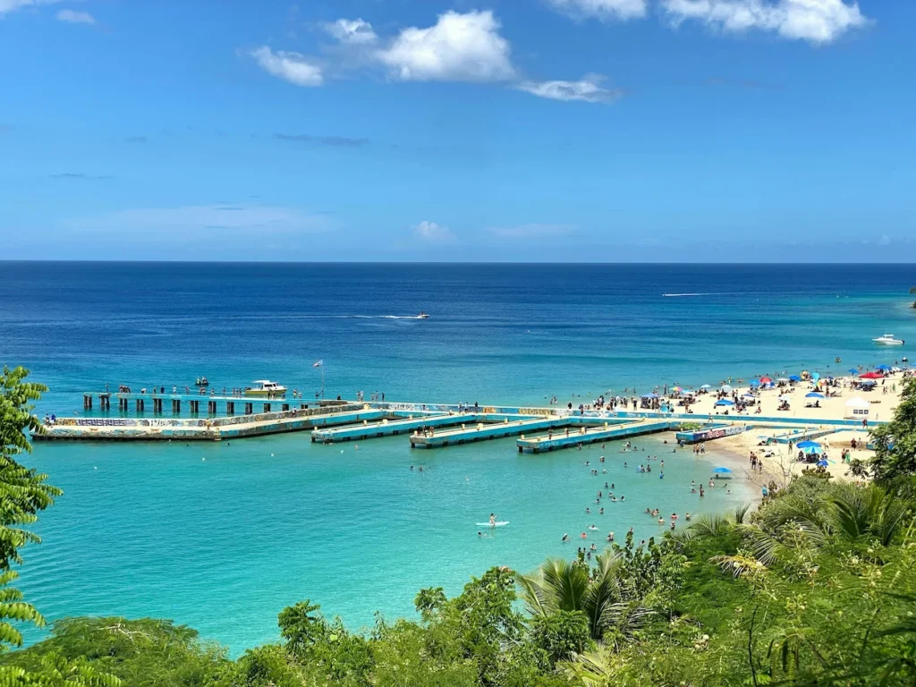 High-angle view of the blue piers and turquoise water at Crash Boat Beach