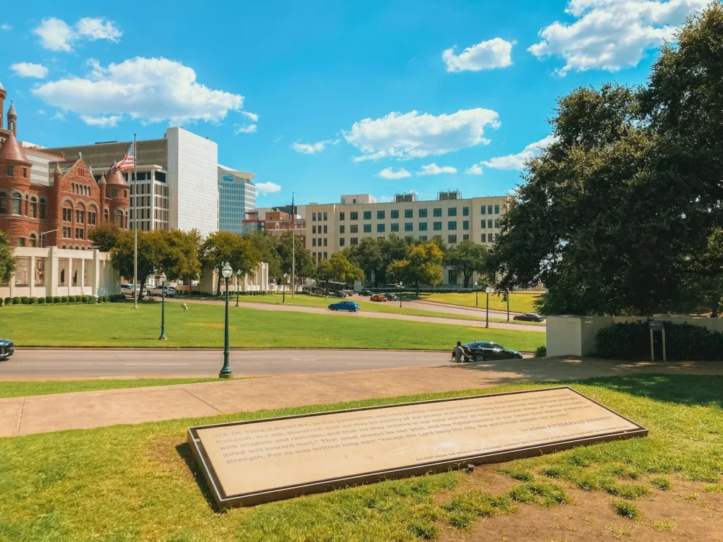The grassy knoll and concrete pergola at the Dealey Plaza historic site in Dallas
