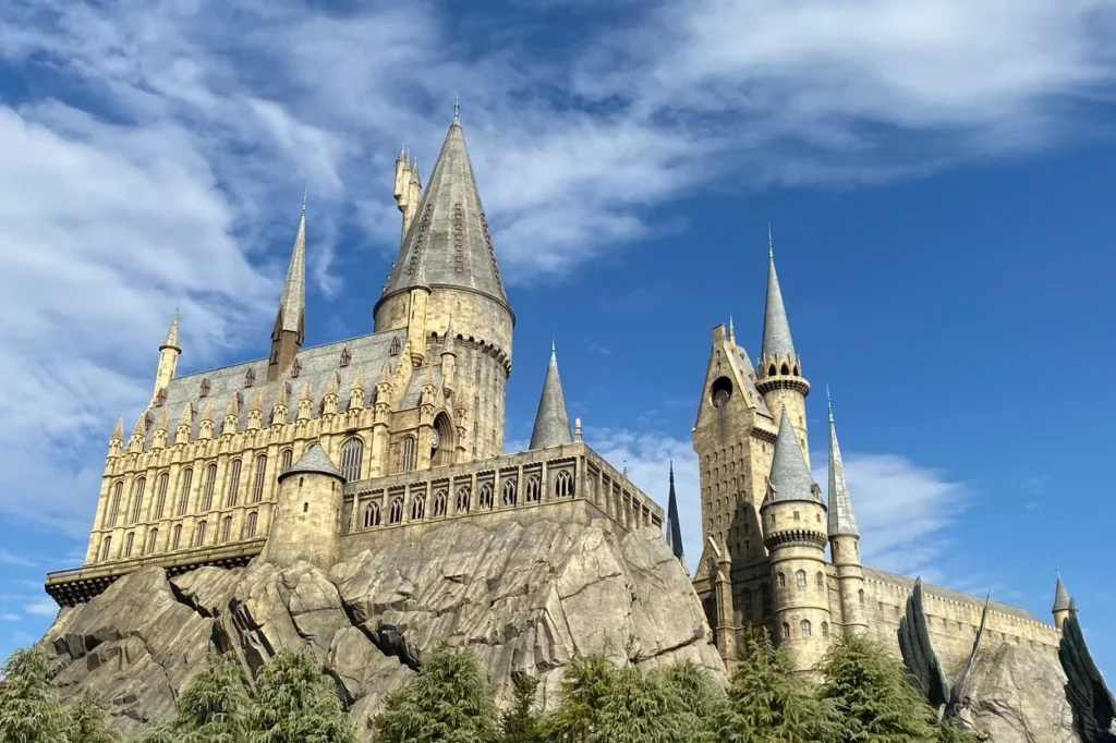 Hogwarts Castle towering over the wizarding village at Universal Studios